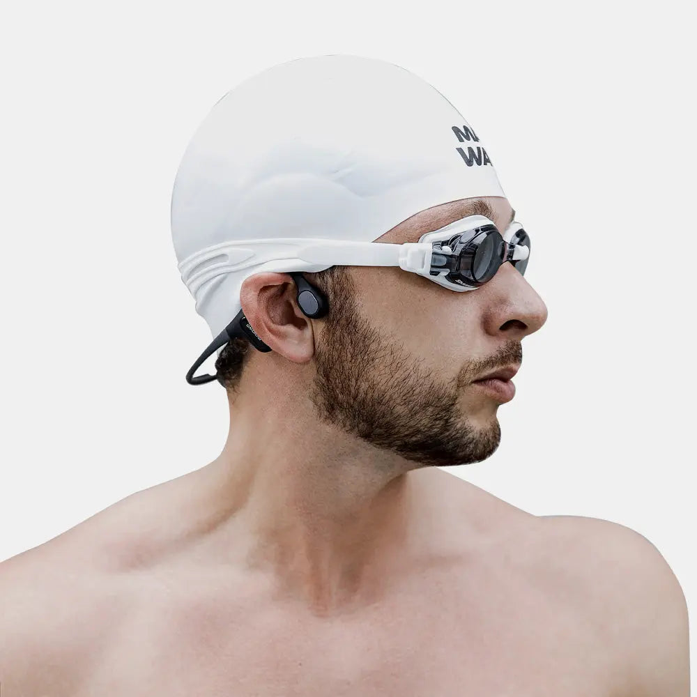 Swimmer wearing Run Plus IP68 waterproof bone conduction headphones in pool